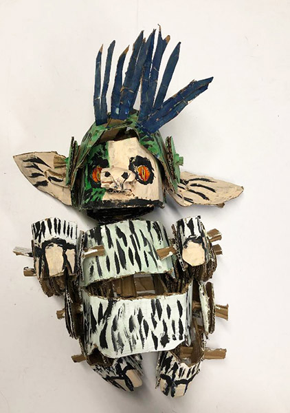 Brent Brown | BRB717 | Dark Grem, 2020 | 
	 Cardboard, Mixed Media | 13 x 19 x 10 in. at the Outsider Folk Art Gallery