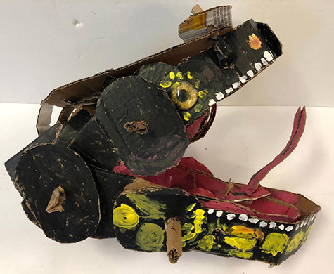 Brent Brown | BRB752 | Coji Komoda Dragon (Cojo's Brother), 2020 | 
	 Cardboard, Mixed Media | 9 x 18 x 10 in. at the Outsider Folk Art Gallery