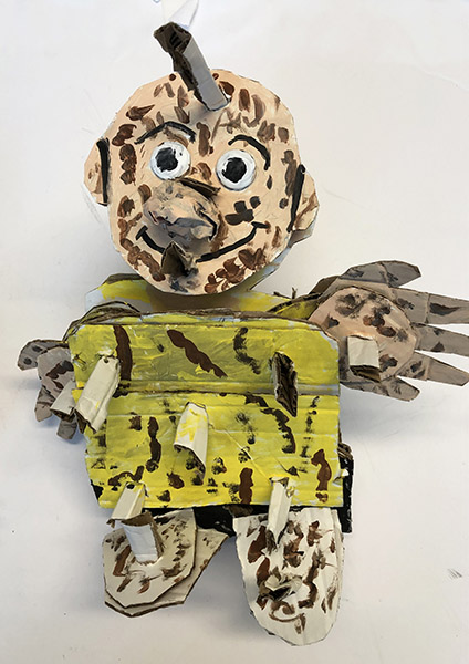 Brent Brown | BRB945 | Pigpen (Peanuts), 2021 | Cardboard, Mixed Media, 12 x 14 x 8 in. at the Outsider Folk Art Gallery