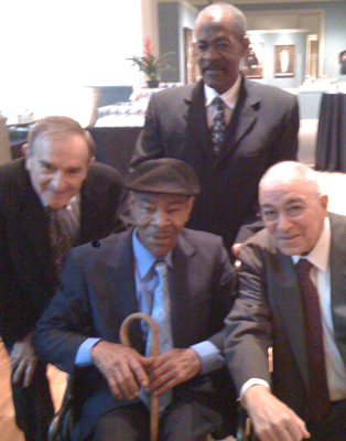 George Viener, left, with Thornton Dial, center front, at "Hard Truths: The Art of Thornton Dial" at Indianapolis Museum of Art opening.